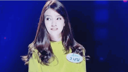 a woman with a name tag that says 3 uru on it