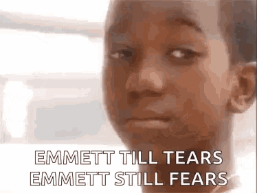 a close up of a young boy 's face with the words `` emmett till tears emmett still fears ''