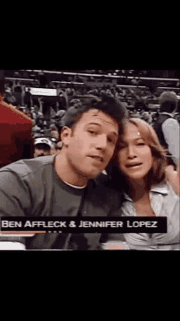 ben affleck and jennifer lopez are posing for a photo
