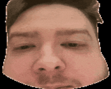 a close up of a man 's face with a black background