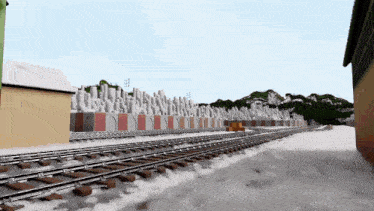 a computer generated image of a snowy train yard with a building in the background