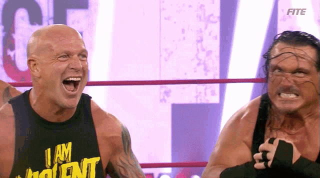 a man wearing a shirt that says i am violent is laughing