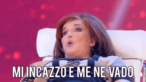 a woman is sitting in a chair with the words mi incazzo e me ne vado