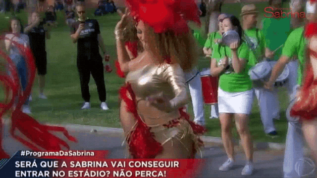 a group of people are dancing in front of a sign that says sabrina on it