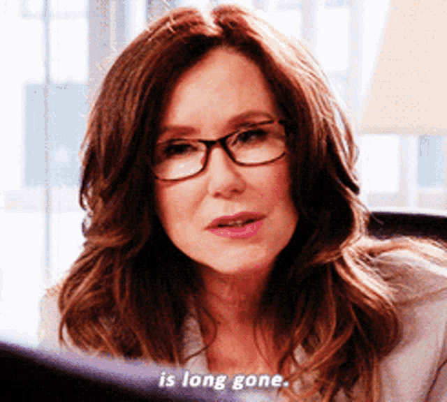 a woman wearing glasses is saying that she is long gone
