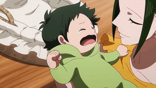 a crying baby is being held by a woman
