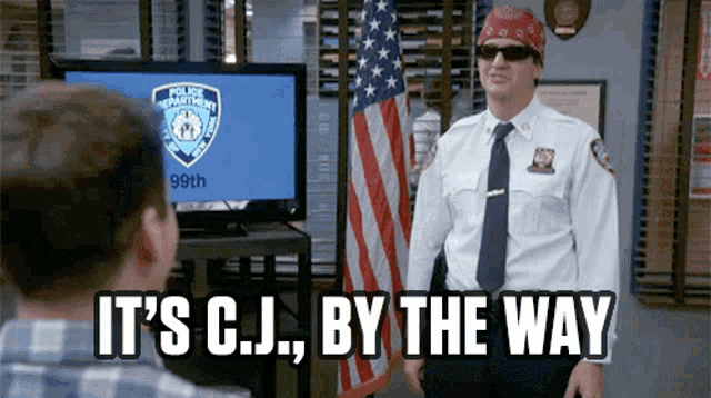 a police officer wearing sunglasses and a bandana says it 's cj by the way