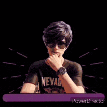 a man wearing sunglasses and a black shirt that says nevada on it
