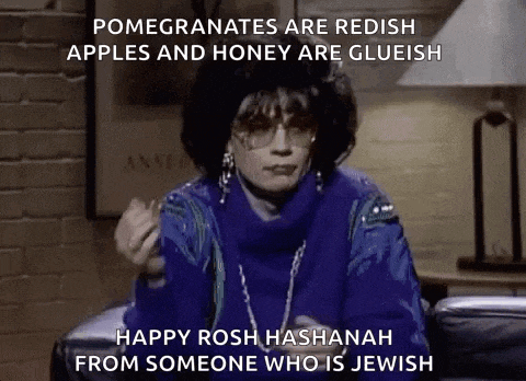 a woman is sitting on a couch with the words pomegranates are redish apples and honey are glueish .