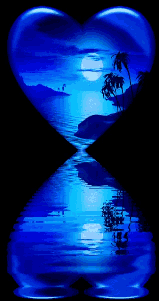 a blue heart with a picture of a sunset in the background