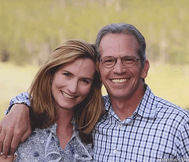a man and a woman are posing for a picture and smiling