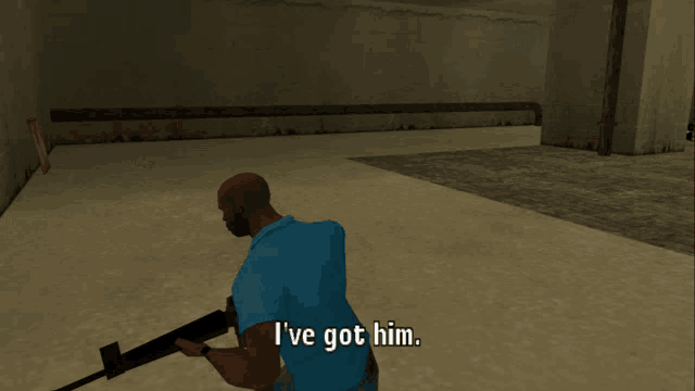 a man in a blue shirt is holding a rifle and says i 've got him