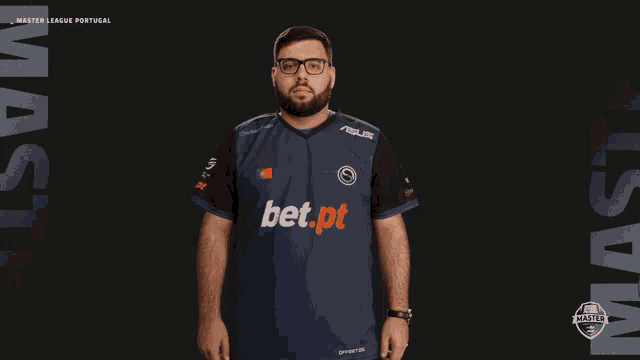 a man with glasses and a bet.pt shirt on