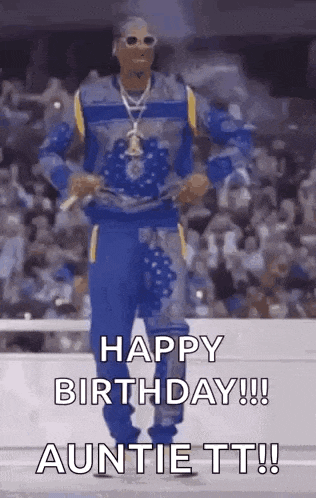 snoop dogg is dancing in front of a crowd and saying happy birthday auntie tt .