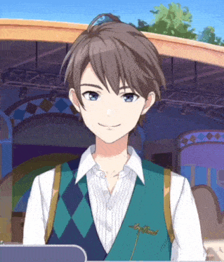 a boy with a green vest that says ' ariel ' on it is smiling