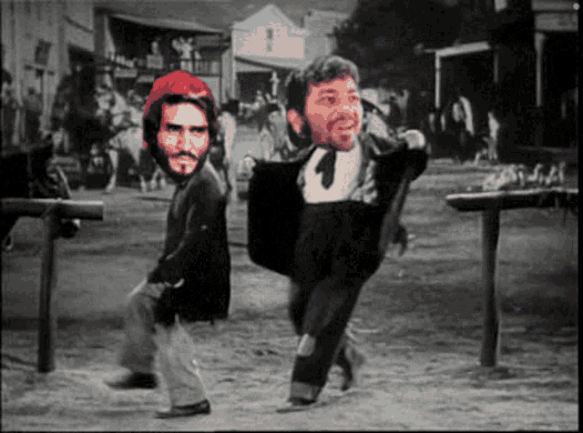 a black and white photo of a man carrying another man