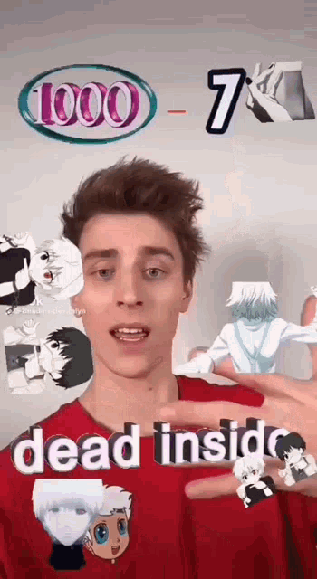 a young man in a red shirt is holding up a dead inside sticker .