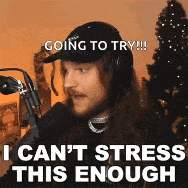 a man wearing headphones and a hat says going to try i can t stress this enough