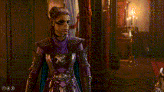 a man and a woman in armor are standing next to each other in a room .