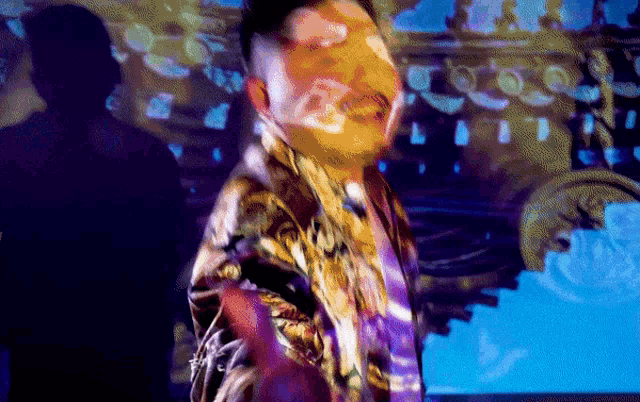 a blurry picture of a man with a purple background