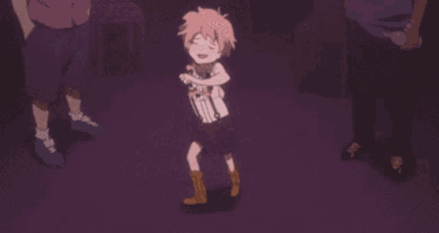 a little girl with pink hair is dancing in front of a group of people
