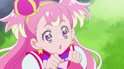a cartoon girl with pink hair and a bow on her head