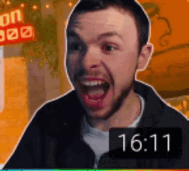 a man with his mouth open and a clock that says 16:14