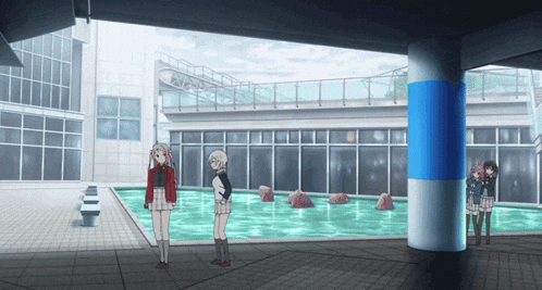 two girls standing in front of a pool with a blue pillar