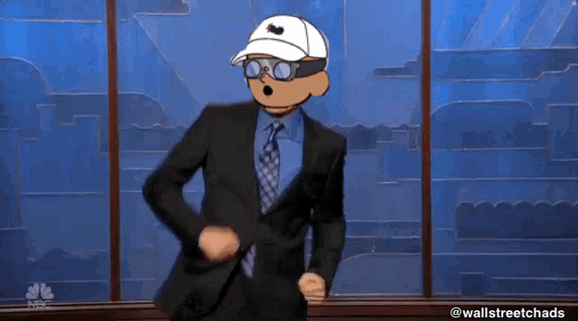 a man in a suit and tie is dancing in front of a nbc window
