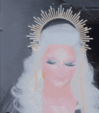 a close up of a mannequin wearing a wig and a headband .