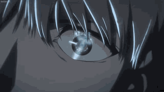 a close up of a person 's eye with a blue light shining through it