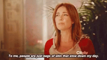 a woman in a red sweater says to me people are just bags of skin that slow down my day .