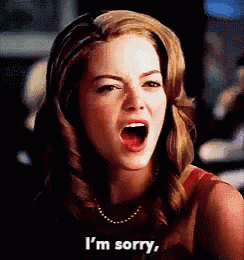 a woman is making a funny face and says i 'm sorry .