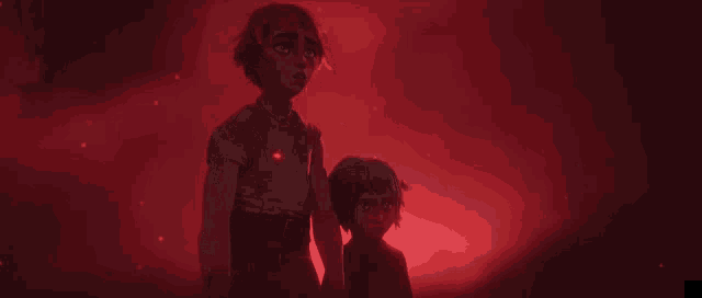 a couple of people standing next to each other in a dark room with red lights behind them .