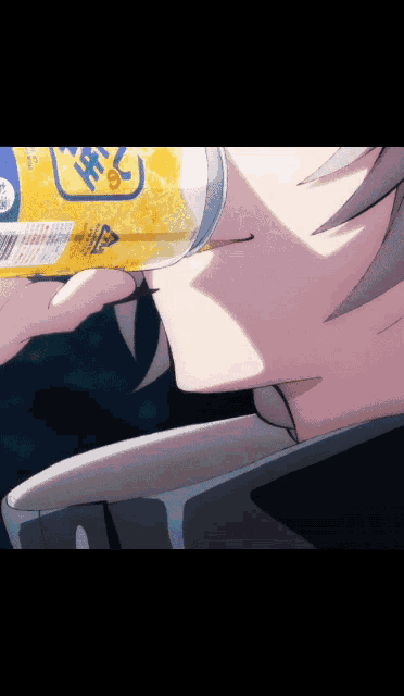 a close up of a person drinking from a bottle that says ' a ' on it