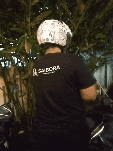 a blurry picture of a person wearing a helmet and a black shirt