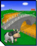 a cow is standing in a field next to a bridge in a video game .