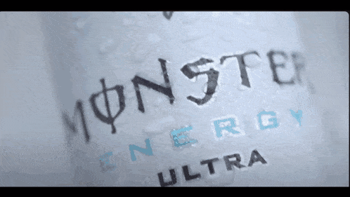 a bottle of monster energy ultra is sitting on a table
