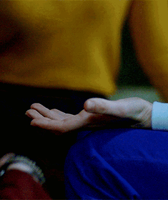 a close up of a person 's hand with their fingers crossed