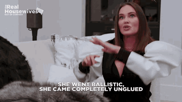 a woman sitting on a couch with the words " she went ballistic she came completely unglued " above her