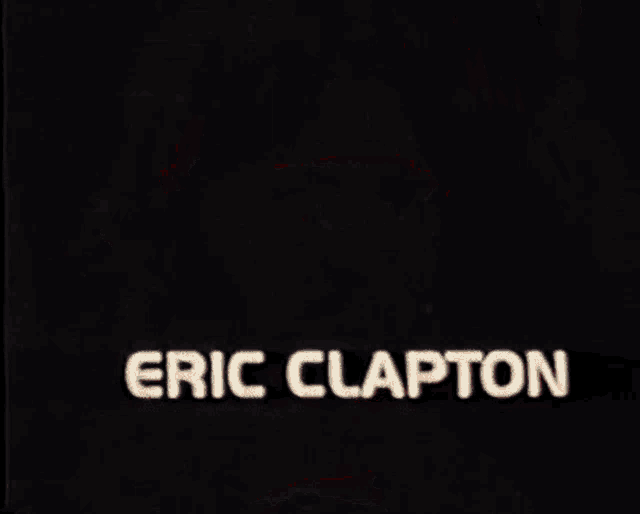 eric clapton 's face is shown in a black and red background