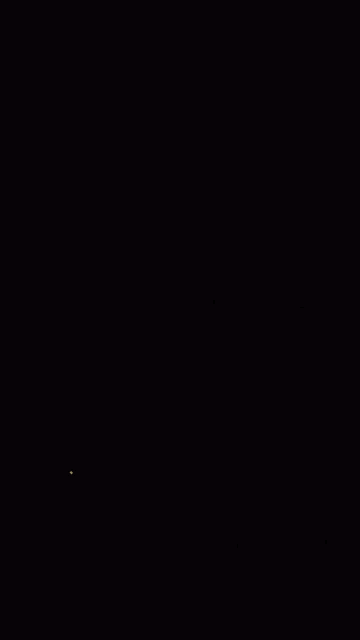 a dark room with a few lights shining on it
