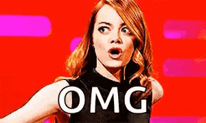 a woman with a surprised look on her face is standing in front of a red background with the word omg on it .
