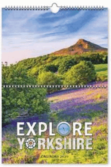 a calendar that says explore yorkshire with a mountain in the background