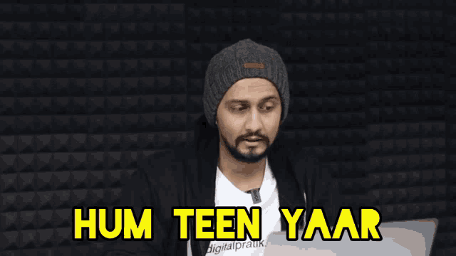 a man giving a peace sign with the words hum teen yaar written above him