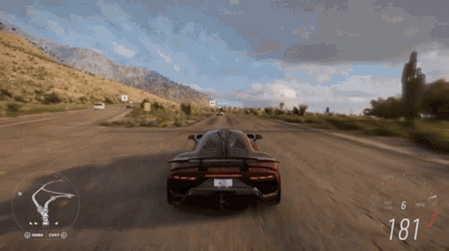 a car is driving down a dirt road with a speedometer that says 181