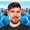 a blurry picture of a man 's face with a beard and mustache .