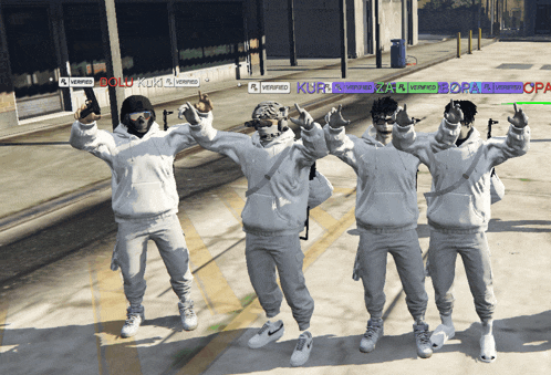 a group of people wearing white hoodies are standing on a sidewalk and one of them has the word verified on their shirt