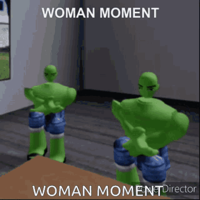 two green hulks are standing next to each other in a room with the words woman moment woman moment director .