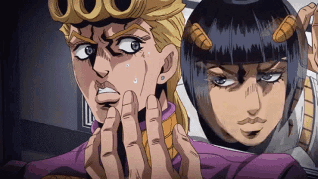 a couple of anime characters are standing next to each other and one of them has horns on his head .